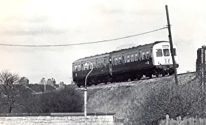 A British Rail diesel train roars along the track near Tyne Dock Station A British Rail diesel train roars along the track near Tyne Dock Station