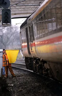 A British Rail workman using the old fashioned hand and flag signal on 1st, December 1994 A British Rail workman using the old fashioned hand and flag signal on 1st, December 1994