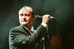 Images Dated 13th March 1990: British singer Phil Collins performing on stage during a concert in Britain