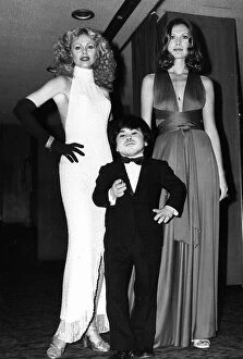 Facial Expressions Gallery: Britt Ekland actress with Maud Adams and Herve Villechaize at premiere of