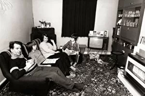 The Brown family gather together in family living room to watch television January 1982