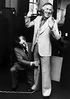 00071 Gallery: Bruce Forsyth Entertainer being measured up for a new suit
