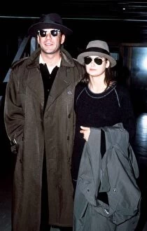 Bruce Willis with his wife Demi Moore pictured arriving at London Heathrow Airport
