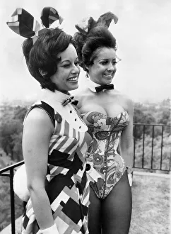 Bunny Girls at Playboy. One woman wears a basque, the other wears a dress; plus bow ties Bunny Girls at Playboy. One woman wears a basque, the other wears a dress; plus bow ties