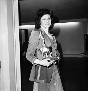 Images Dated 15th April 1975: Bunny of the year Caroline Moore pictured holding the award she won in the '