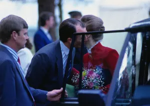 Images Dated 8th December 1999: Captain Mark Phillips June 1988 giving Princess Anne a kiss on cheek at car door