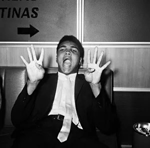 The Louisville Lip Gallery: Cassius Clay, aka (Muhammad Ali) on his way back to the United States after beating