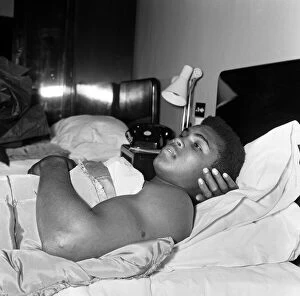 Portrait Posed Gallery: Cassius Clay aka (Muhammad Ali) catches up on some sleep in the Piccadilly Hotel