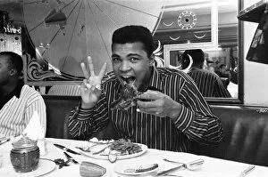 Muhammad Ali Gallery: Cassius Clay (Muhammad Ali) eating stake at Isows restaurant in Soho Brewer Street London
