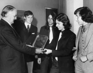 Chairman of the Stock Exchange, George Loveday, presents the winning trophy to Chairman of the Stock Exchange, George Loveday, presents the winning trophy to
