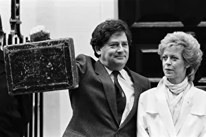 01256 Gallery: Chancellor of the Exchequer Nigel Lawson outside 11 Downing Street with his wife Therese
