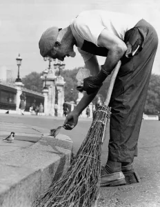 Charles breaks off from sweeping the streets outside Buckingham Palace Charles breaks off from sweeping the streets outside Buckingham Palace