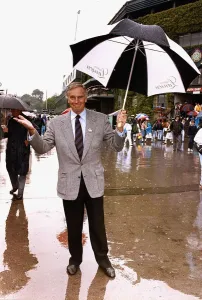Charlton Heston American Actor at Wimbledon Holding umbrella Charlton Heston American Actor at Wimbledon Holding umbrella