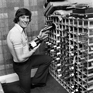 Chelsea striker Ian Hutchinson selects a suitable bottle of champagne in readiness for Chelsea striker Ian Hutchinson selects a suitable bottle of champagne in readiness for