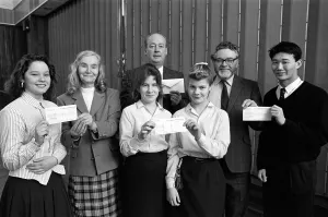 Cheques are presented to charity representatives at All Saints RC High School Cheques are presented to charity representatives at All Saints RC High School