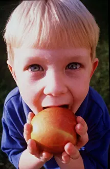 A child is pictured eating in Eating feature April 1999 A child is pictured eating in Eating feature April 1999