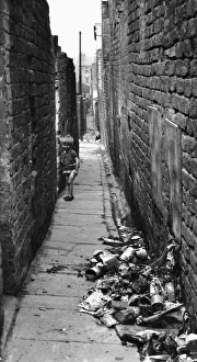 Child playing in alleyway at rear of Gordon Street and Elias Street, Toxteth, Liverpool Child playing in alleyway at rear of Gordon Street and Elias Street, Toxteth, Liverpool
