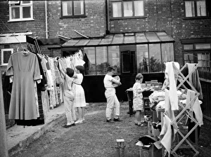 Children clear their bedrooms by having a yard sales in Coventry. Circa 1965 Children clear their bedrooms by having a yard sales in Coventry. Circa 1965