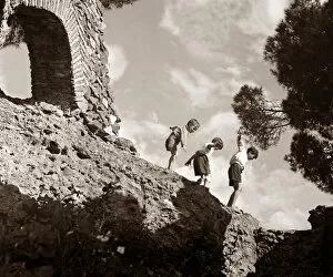 Images Dated 24th November 2004: Children climbing amongst the ruins of a castle circa 1950 childhood holidays