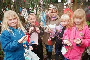 Images Dated 4th December 1994: Children decorating trees with christmas decorations in Hancocks Wood, Loftus