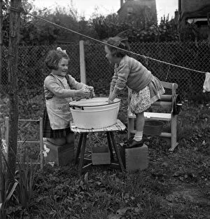 Chores Gallery: Children hanging out washing on the line in class at Cookham Nursery School