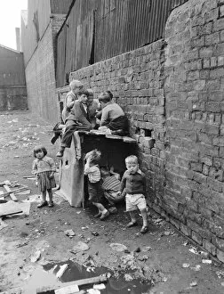 Friendship Collection: Children playing in the back alleys of a Goven tenement block. September 1956