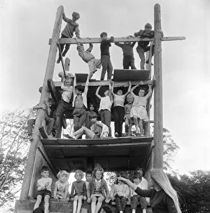 Children playing on climbing frames at the adventure playground in Moulsecomb, Brighton Children playing on climbing frames at the adventure playground in Moulsecomb, Brighton