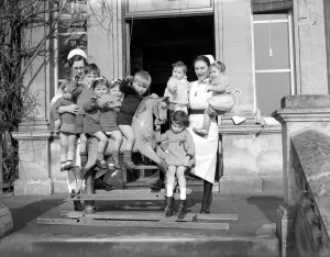 Children playing on a rocking horse at a day nursery in London circa 1945 Children playing on a rocking horse at a day nursery in London circa 1945