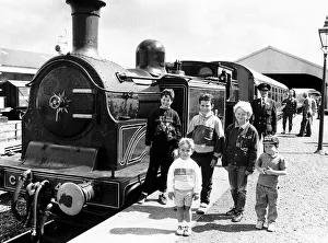 Images Dated 1st June 1985: Children stand next to the Caledonian loco No 419 Steam Train owned by the Scottish
