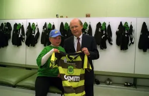 Chris Cavan age 9 burns boy with Fergus McCann at Celtic Park holding football strip top Chris Cavan age 9 burns boy with Fergus McCann at Celtic Park holding football strip top