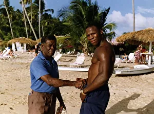 Images Dated 21st February 1991: Chris Eubank Boxing shaking hands with man on beach