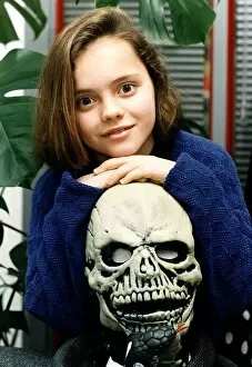 Images Dated 11th December 1991: Christina Ricci actress child The Addams Family hands on skull