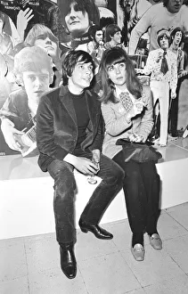 00054 Gallery: Christine Shrimpton with David Bailey. sitting in front of Photographic montage