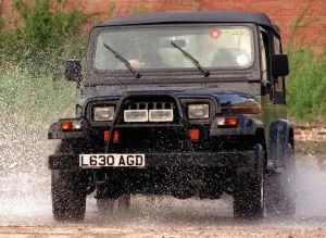 Chrysler Jeep Wrangler driven through puddles with bull bars fitted Chrysler Jeep Wrangler driven through puddles with bull bars fitted