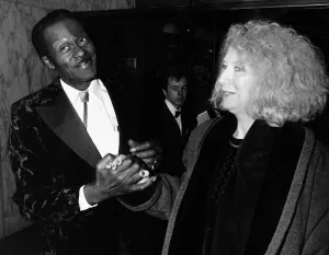 Chuck Berry greets woman at film premiere 1988 Holding hands Chuck Berry greets woman at film premiere 1988 Holding hands