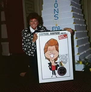 Cilla Black September 1988 holding poster of herself presented by Daily Record