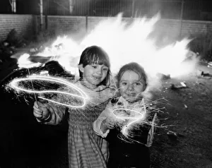 Clare aged 6 and Lindsay Gerard aged four (right) enjoying their sparklers at an Clare aged 6 and Lindsay Gerard aged four (right) enjoying their sparklers at an