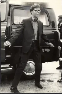 Cliff Richard in glasses getting out of a taxi 1964 Cliff Richard in glasses getting out of a taxi 1964