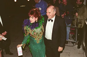 Clive James Gallery: Clive James arrives for the 1995 Comedy Awards with Margarita Pracatan