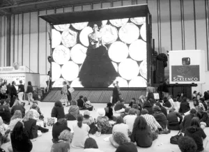 00492 Gallery: Clothes Show Live, visitors to the clothes show relax beneath one of the giant video