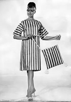Clothing Beach. Striped beach dress and matching bag. July 1964 P017999 Clothing Beach. Striped beach dress and matching bag. July 1964 P017999