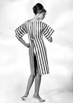 Clothing Beach. Striped beach dress with open back. July 1964 P017997 Clothing Beach. Striped beach dress with open back. July 1964 P017997