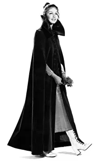 Clothing: We dressed Biddy Lampard in a 'nun'-like dark purple cape Clothing: We dressed Biddy Lampard in a 'nun'-like dark purple cape