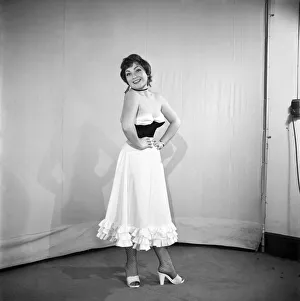 Clothing: Fashion: Spanish Skirt: Woman wearing flamenco style skirt. 1959 E98-002 Clothing: Fashion: Spanish Skirt: Woman wearing flamenco style skirt. 1959 E98-002
