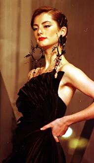 Clothing by Valentino 1998 Model wearing black evening dress clothing designed by Clothing by Valentino 1998 Model wearing black evening dress clothing designed by