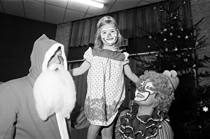 A clown and Father Christmas visiting Kemplah Primary School, Guisborough. December 1985 A clown and Father Christmas visiting Kemplah Primary School, Guisborough. December 1985