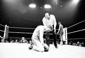 Colin Jones of Wales on the floor after a low punch in the 8th round of his defence of Colin Jones of Wales on the floor after a low punch in the 8th round of his defence of