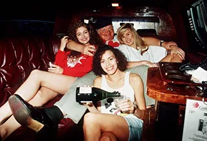 Comedian Benny Hill in a car with some of his Hill's Angels Comedian Benny Hill in a car with some of his Hill's Angels