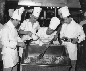 Comedian Frankie Howerd seen here giving the chefs of an unnamed Coventry hotel a hand in Comedian Frankie Howerd seen here giving the chefs of an unnamed Coventry hotel a hand in