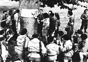 00154 Gallery: Commandant of a Maquis band briefs his fighters 1944 before a raid against the enemy